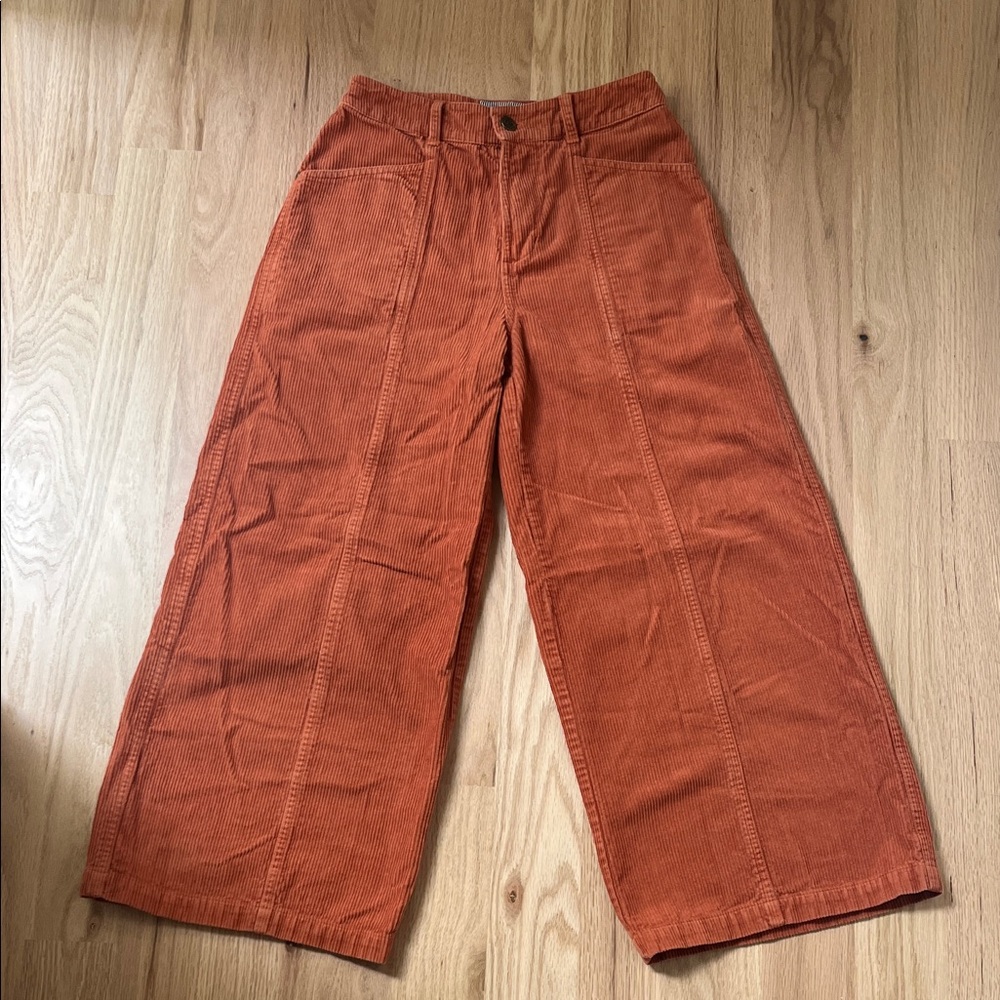 Rust-colored corduroy trousers